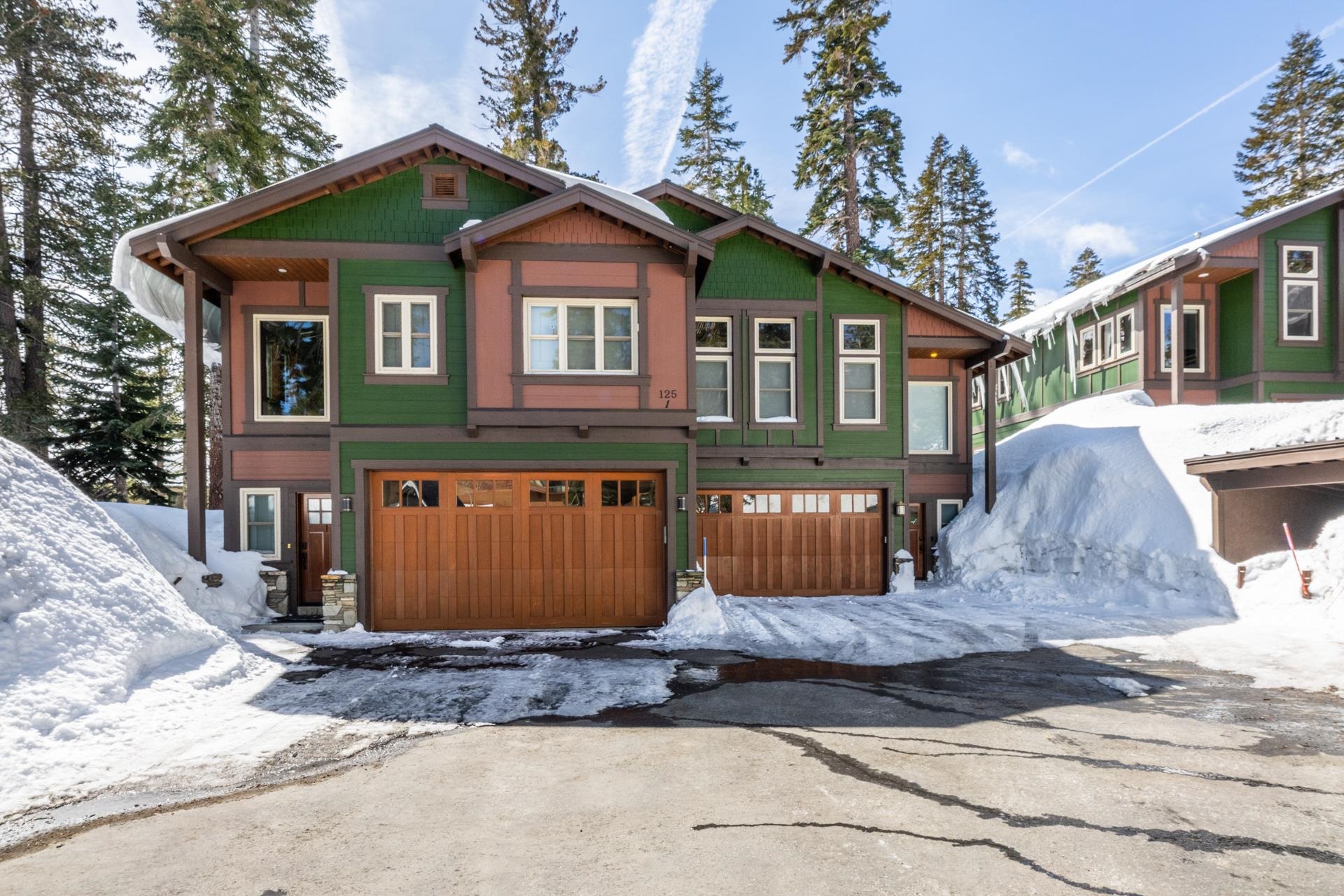 125 Davison Road, Unit 2 Mammoth Lakes, CA 93546 - Photo 48 of 50 a front view of a house with a yard and garage