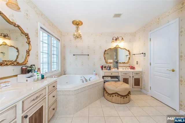 a bathroom with a sink mirror and toilet