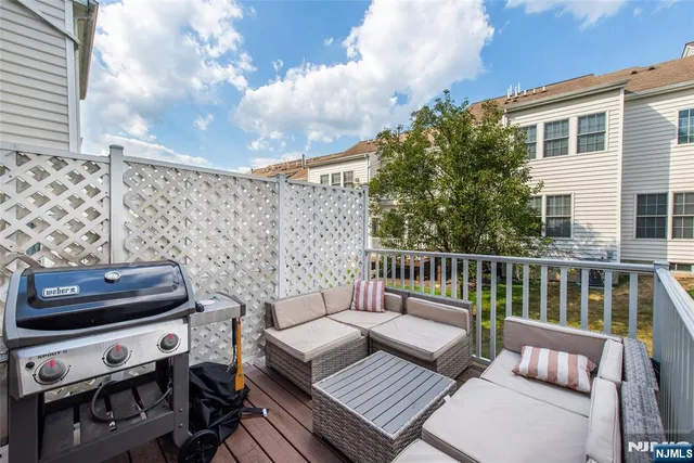 a view of a patio with swimming pool table and chairs
