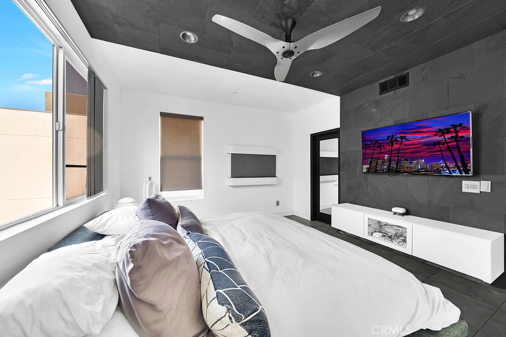 39 Gramercy Irvine, CA 92612 - Photo 12 of 48 a bedroom with a bed and a flat screen tv