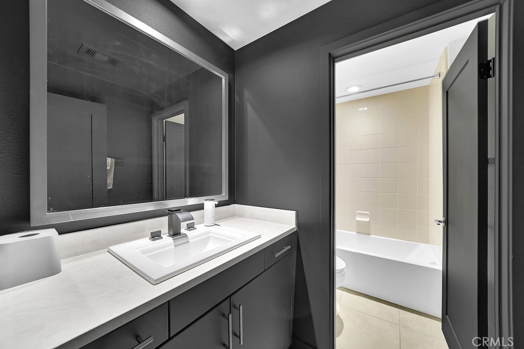 39 Gramercy Irvine, CA 92612 - Photo 19 of 48 a bathroom with a sink and a mirror