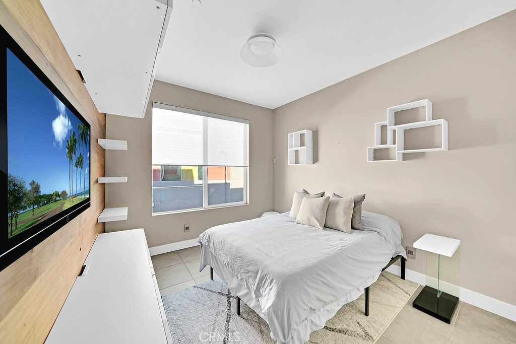 39 Gramercy Irvine, CA 92612 - Photo 20 of 48 a bedroom with a bed and a flat screen tv
