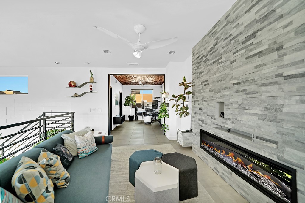 39 Gramercy Irvine, CA 92612 - Photo 23 of 48 a living room with furniture and a rug