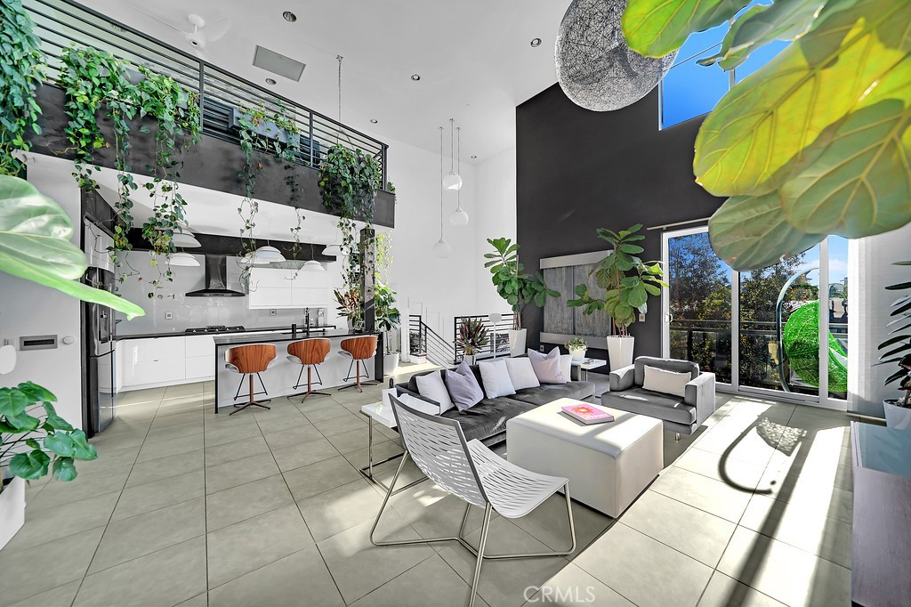 39 Gramercy Irvine, CA 92612 - Photo 3 of 48 a view of a patio with table and chairs potted plants