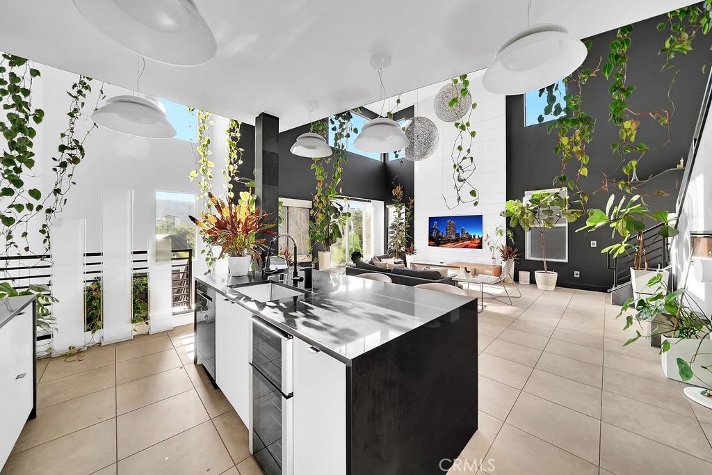 39 Gramercy Irvine, CA 92612 - Photo 8 of 48 a kitchen with a sink stove and cabinets