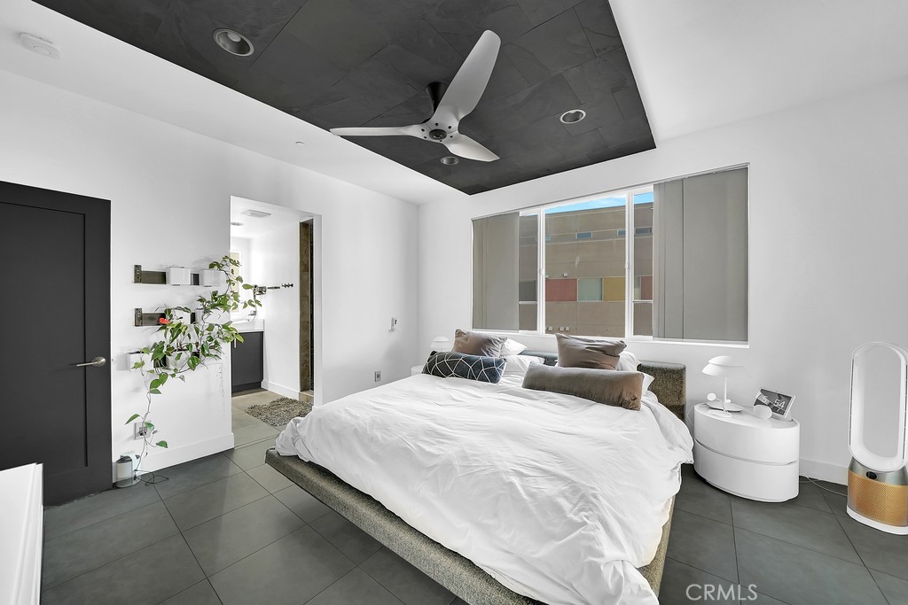 39 Gramercy Irvine, CA 92612 - Photo 10 of 48 a bedroom with a bed and ceiling fan