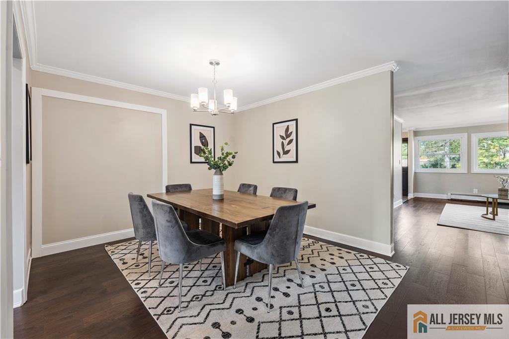 35 Emerald Road Kendall Park, NJ 08824 - Photo 11 of 37 a view of a dining room with furniture and wooden floor