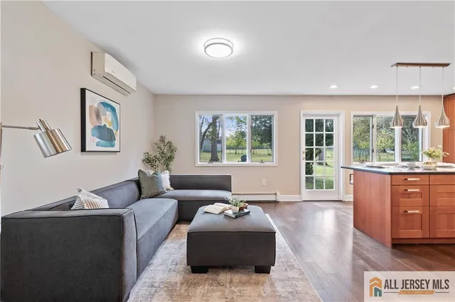 a living room with furniture and windows
