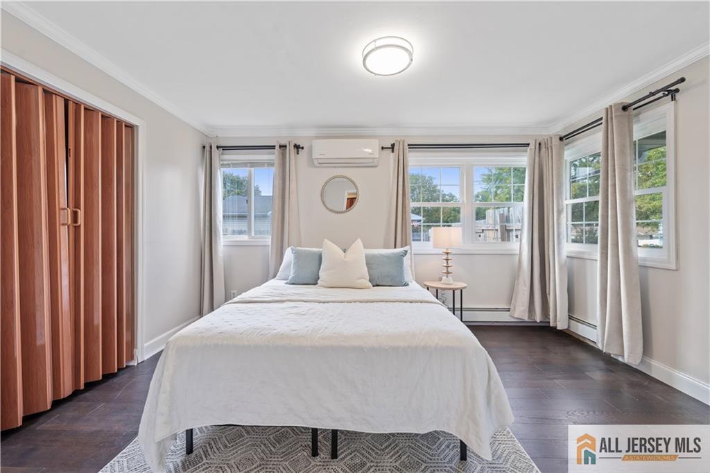 35 Emerald Road Kendall Park, NJ 08824 - Photo 18 of 37 a bedroom with a large bed and a window