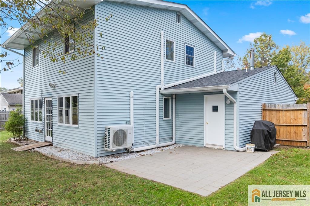 35 Emerald Road Kendall Park, NJ 08824 - Photo 28 of 37 a view of a house with a yard and a garage