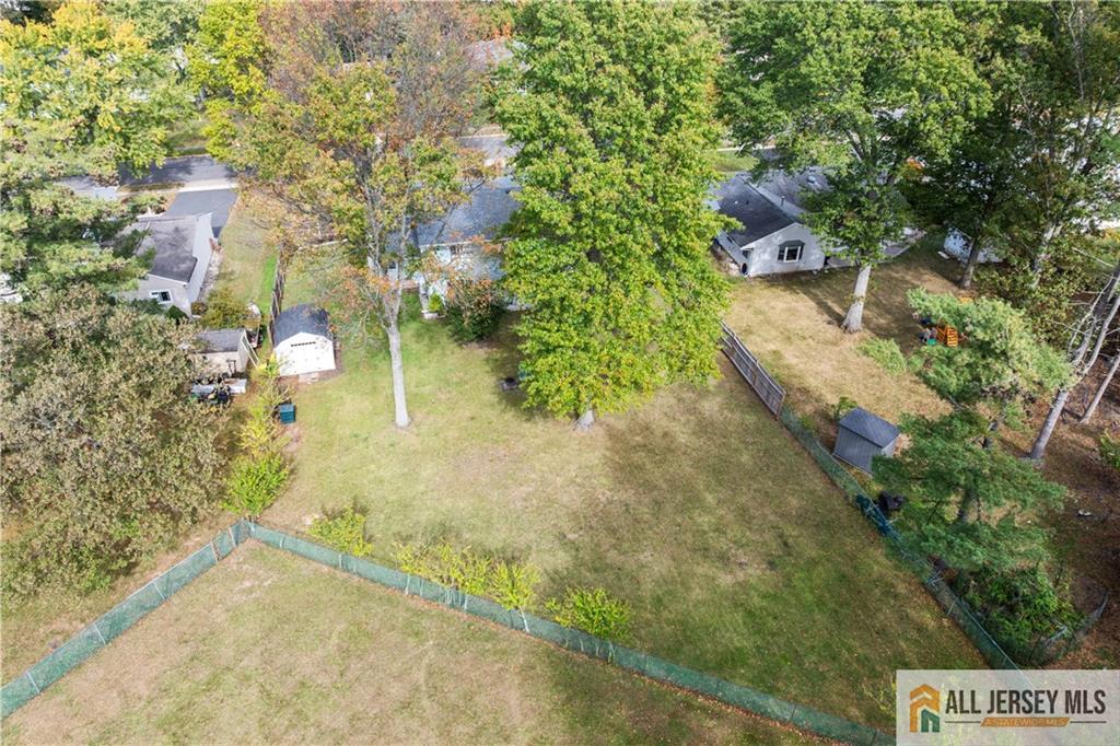 35 Emerald Road Kendall Park, NJ 08824 - Photo 32 of 37 a view of a yard with plants