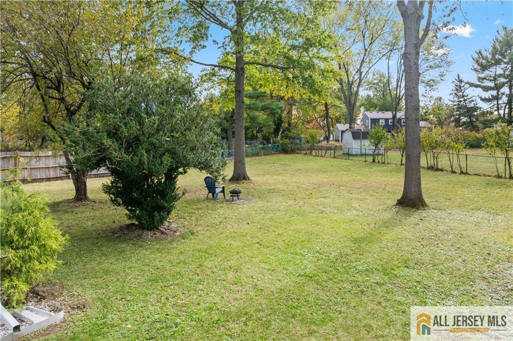 35 Emerald Road Kendall Park, NJ 08824 - Photo 35 of 37 a view of a tree in a yard