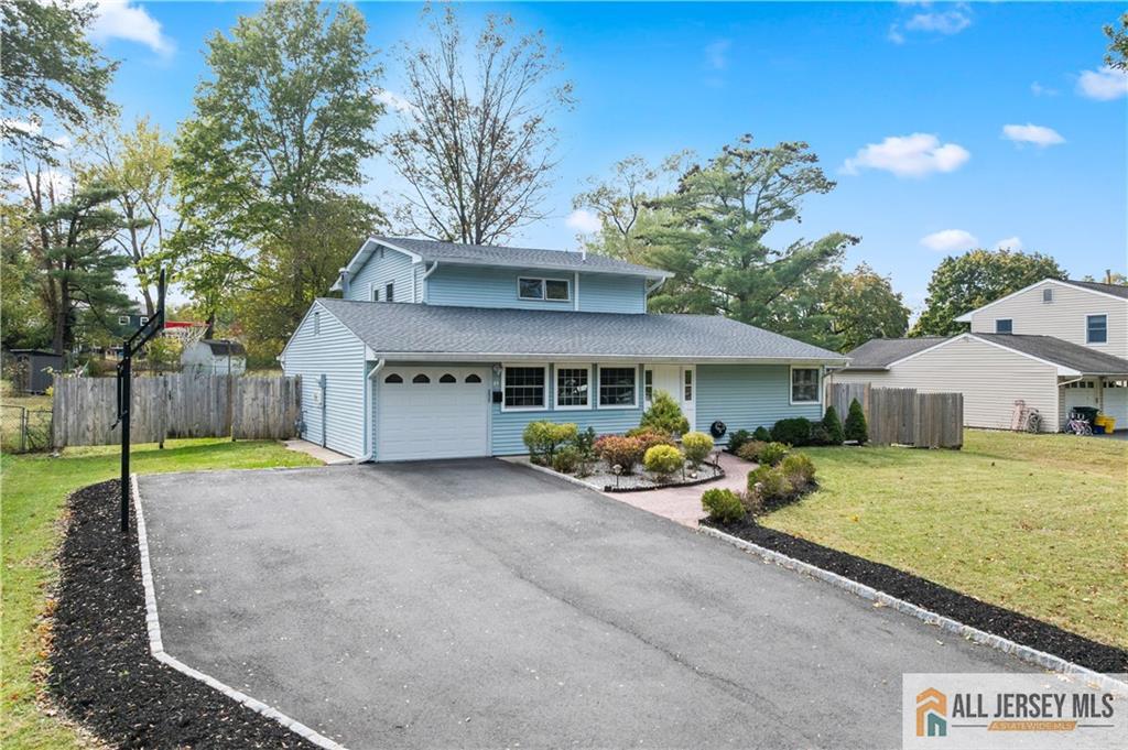 35 Emerald Road Kendall Park, NJ 08824 - Photo 37 of 37 a view of a house with backyard and garden