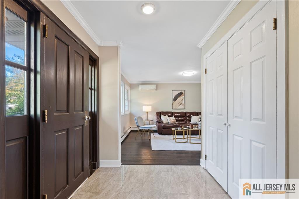 35 Emerald Road Kendall Park, NJ 08824 - Photo 6 of 37 a view of a hallway with the view of living room and dining room