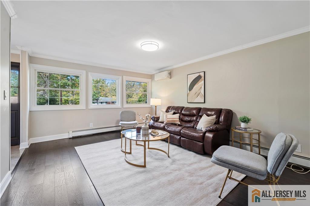 35 Emerald Road Kendall Park, NJ 08824 - Photo 8 of 37 a living room with furniture and a large window