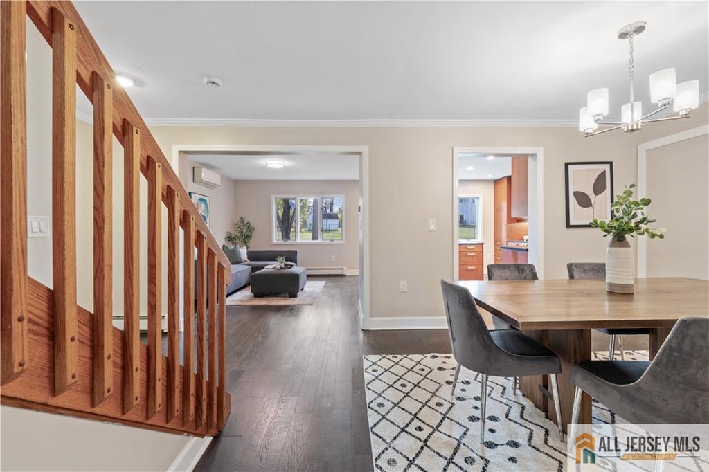 35 Emerald Road Kendall Park, NJ 08824 - Photo 10 of 37 a view of a workspace with furniture and a livingroom