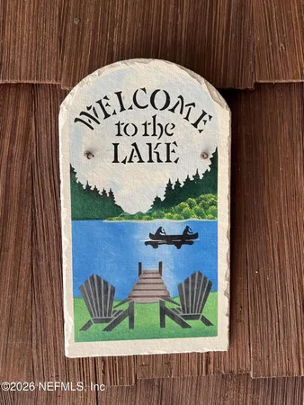 a kitchen with a refrigerator sink and cabinets