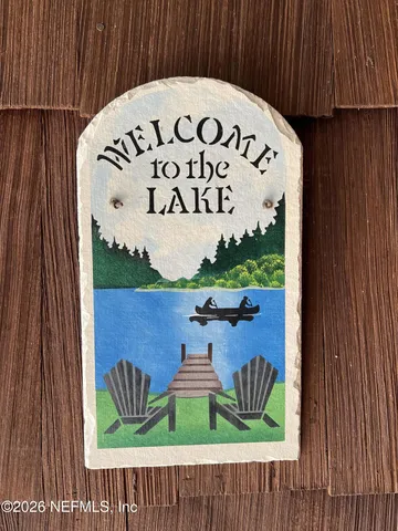 a kitchen with a refrigerator sink and cabinets