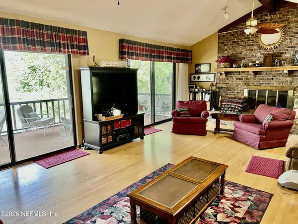 a kitchen with stainless steel appliances granite countertop a sink a stove and a microwave oven