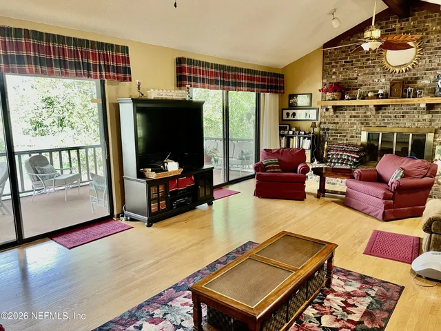 a kitchen with stainless steel appliances granite countertop a sink a stove and a microwave oven