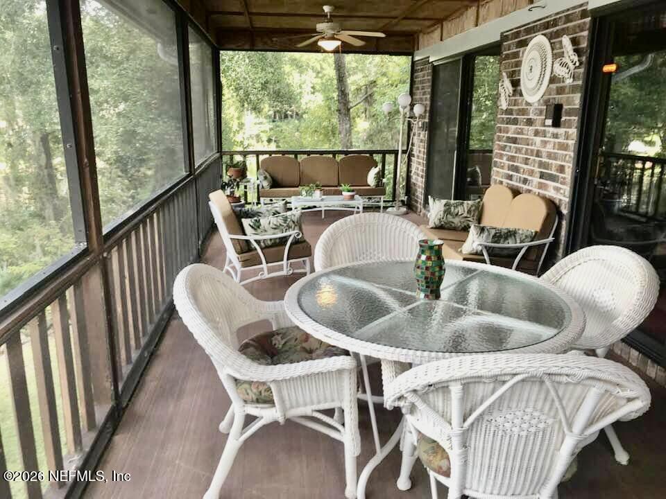 268 Wesley Road Green Cove Springs, FL 32043 - Photo 24 of 84 a dining room with furniture water view and balcony