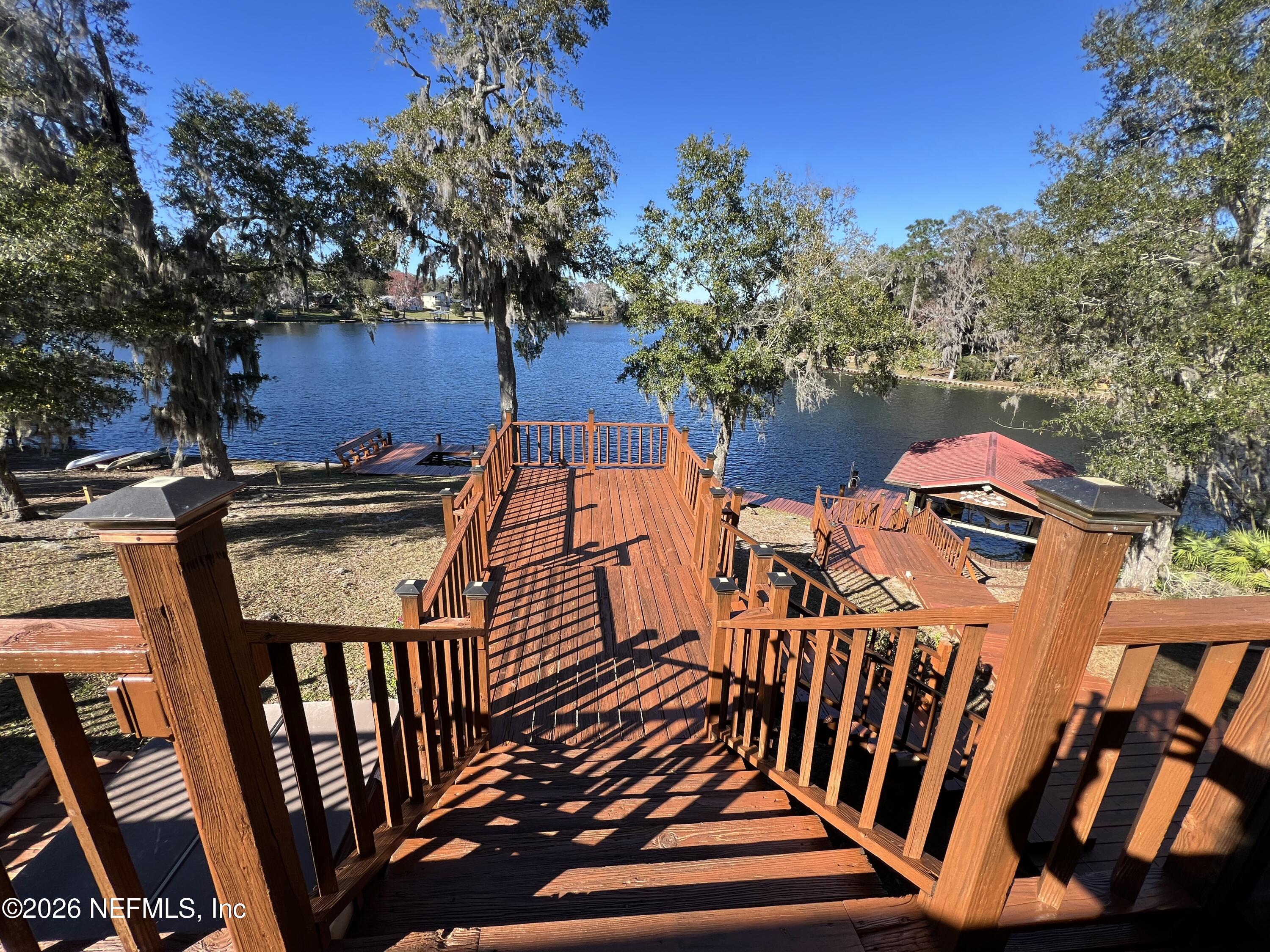 268 Wesley Road Green Cove Springs, FL 32043 - Photo 26 of 84 a view of a chairs and table on the deck