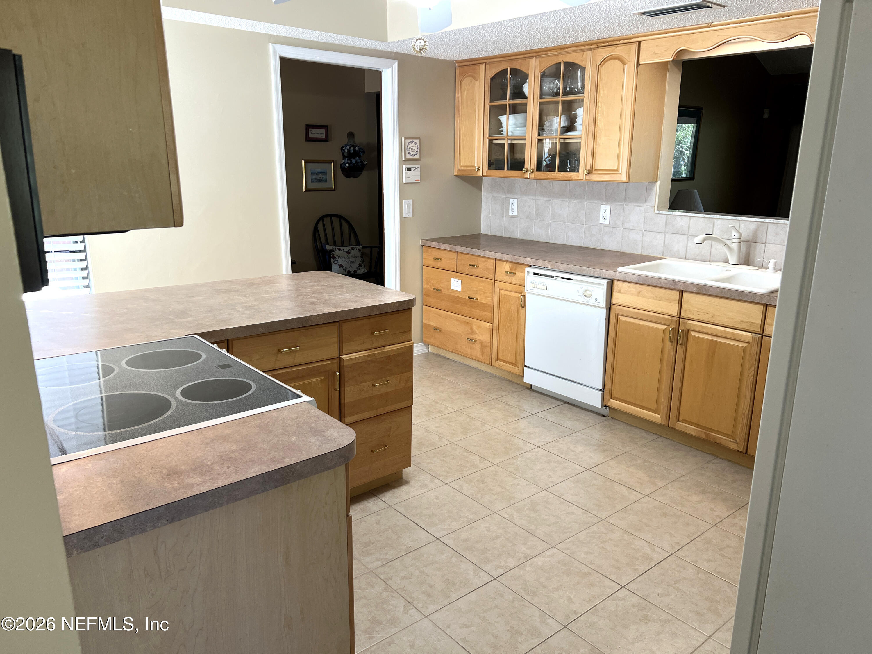 268 Wesley Road Green Cove Springs, FL 32043 - Photo 29 of 84 a kitchen with stainless steel appliances granite countertop a sink and a stove