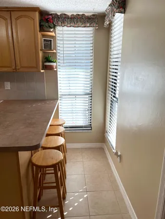 a bathroom with a sink a toilet a mirror and shower