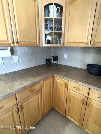 a bathroom with a sink mirror and toilet