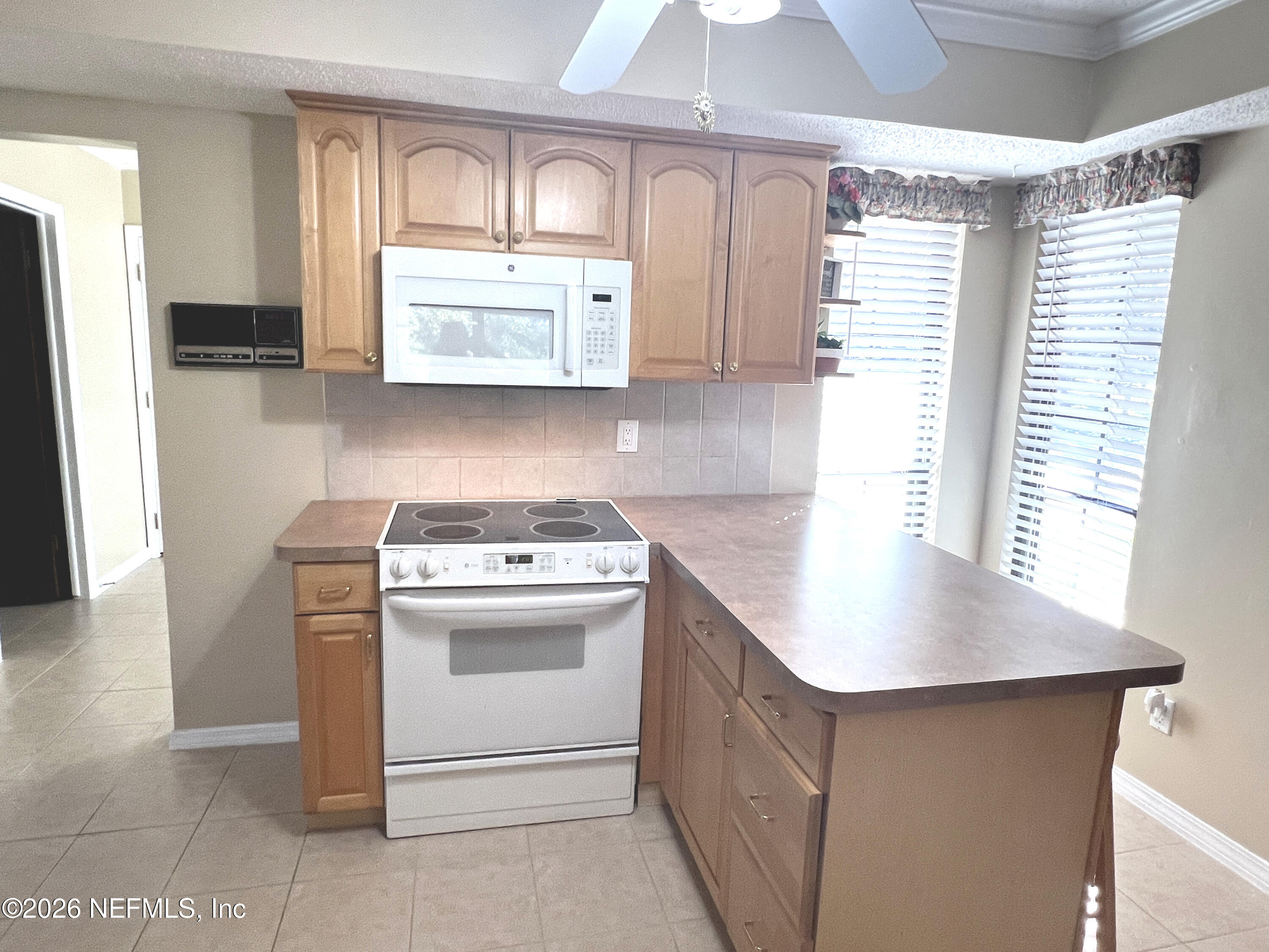 268 Wesley Road Green Cove Springs, FL 32043 - Photo 36 of 84 a kitchen with stainless steel appliances granite countertop a sink stove and refrigerator