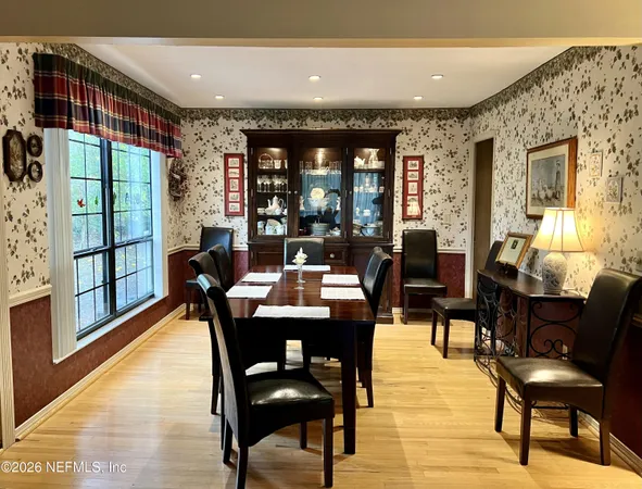 a large kitchen with granite countertop lots of counter space and breakfast area