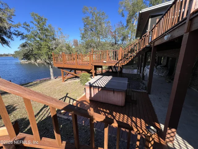 a view of house with backyard and garden
