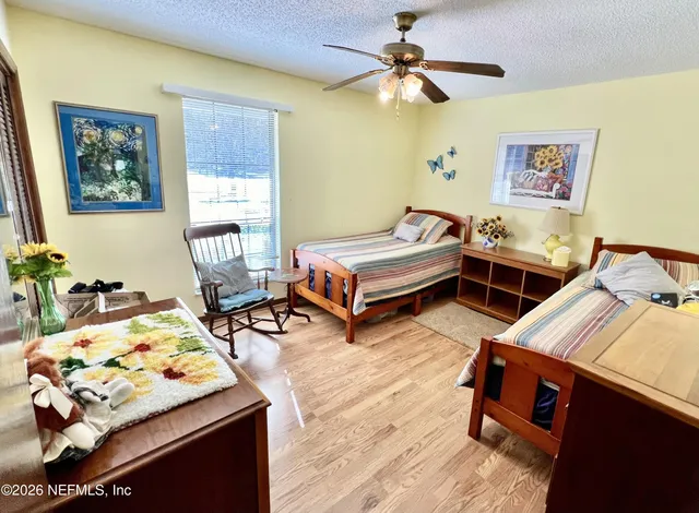 a bedroom with bed and window