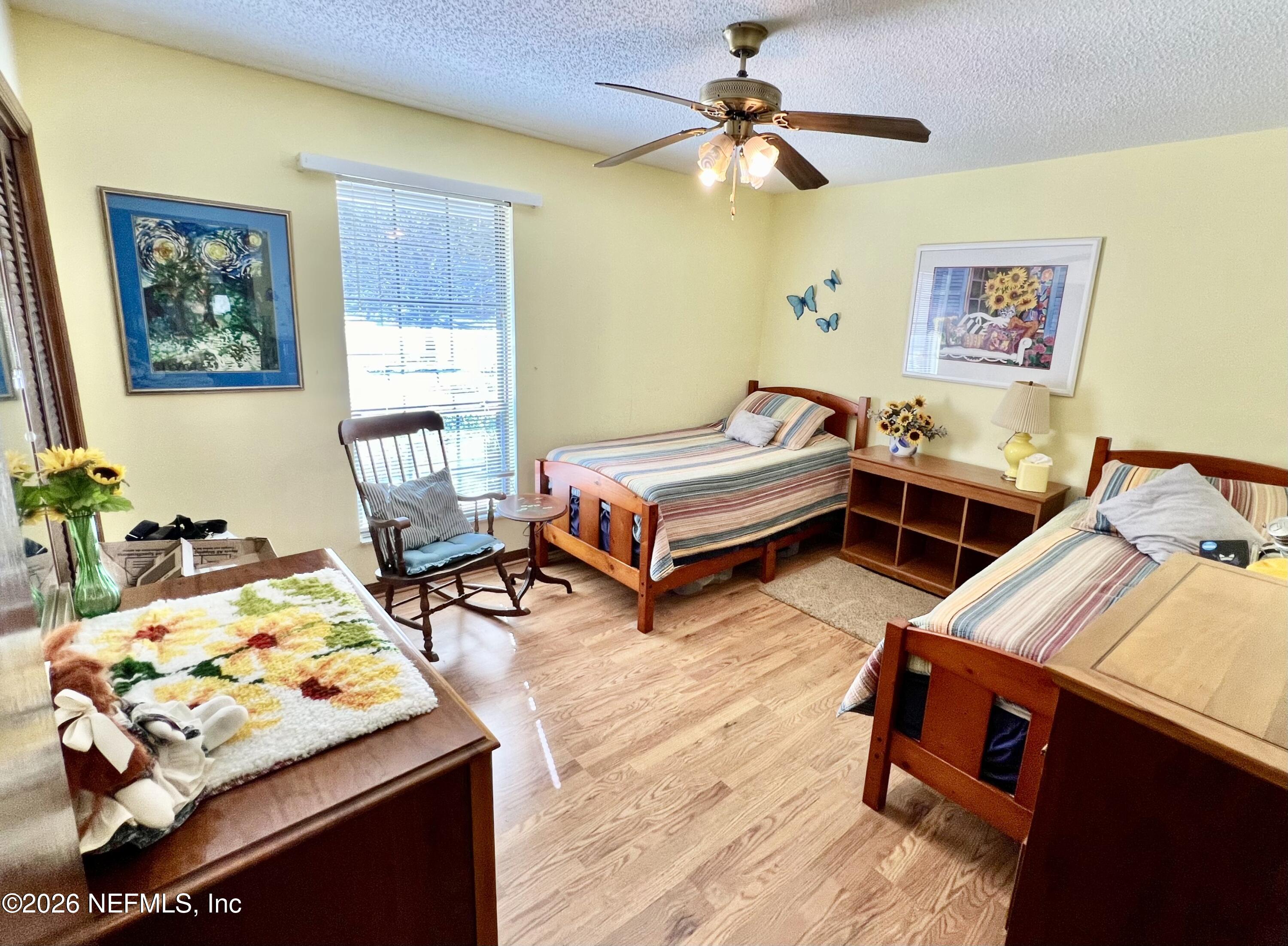 268 Wesley Road Green Cove Springs, FL 32043 - Photo 47 of 84 a living room with furniture and a wooden floor