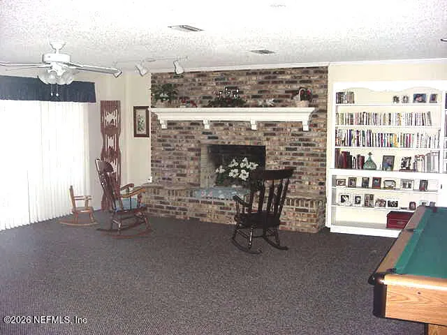 a view of sitting area with furniture