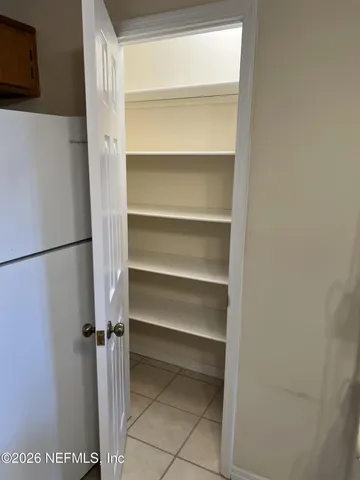 a view of street with large trees