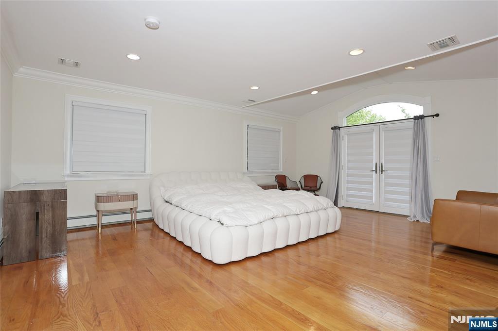 65 Ross Avenue Demarest, NJ 07627 - Photo 22 of 48 a bedroom with a bed and a dresser