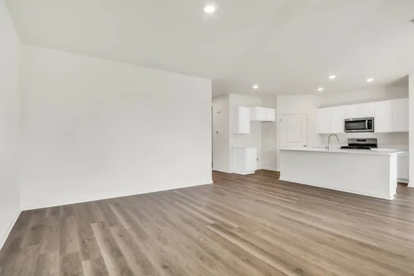 a view of kitchen with wooden floor