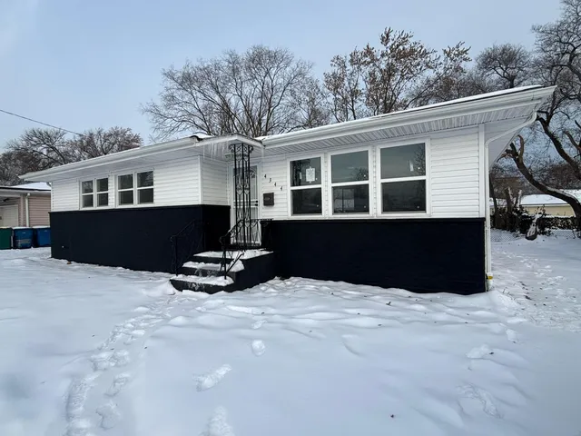 a swimming pool with outdoor seating