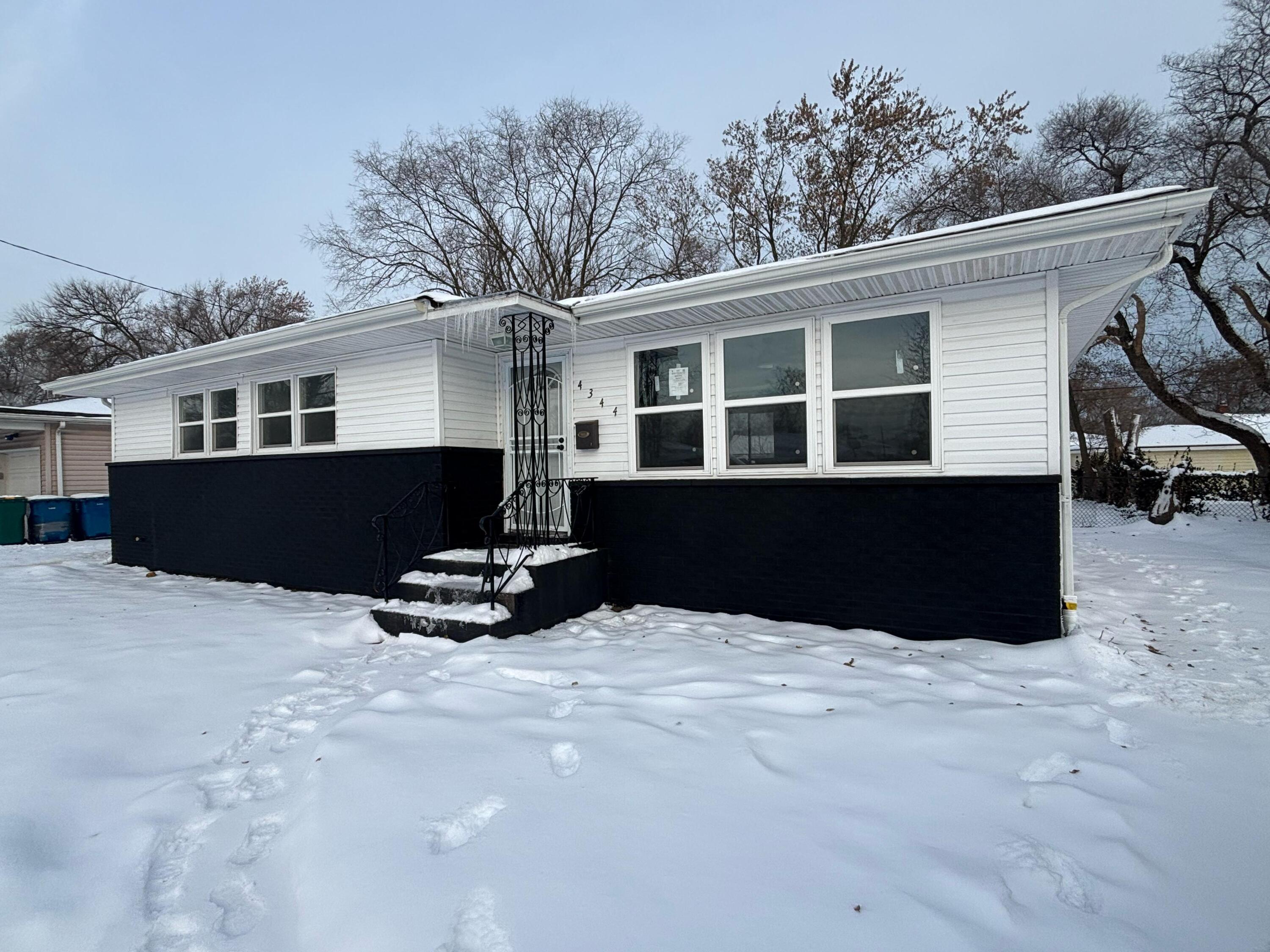 a swimming pool with outdoor seating