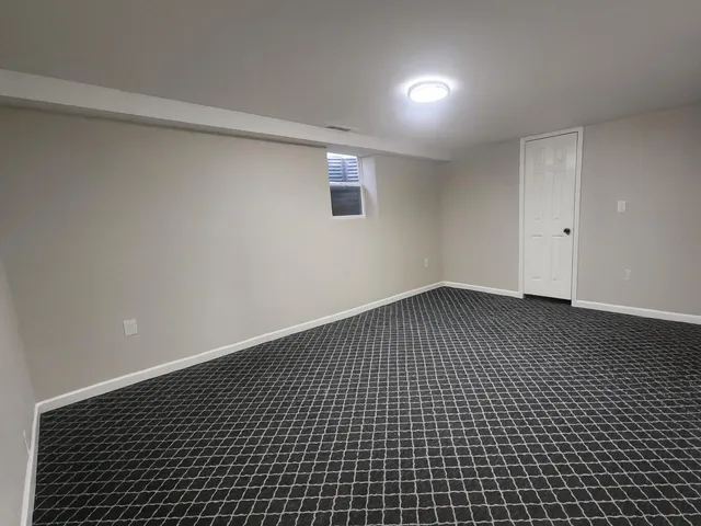 a view of a house with a snow in the background