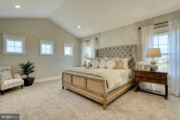 a bed room with a bed and a couch
