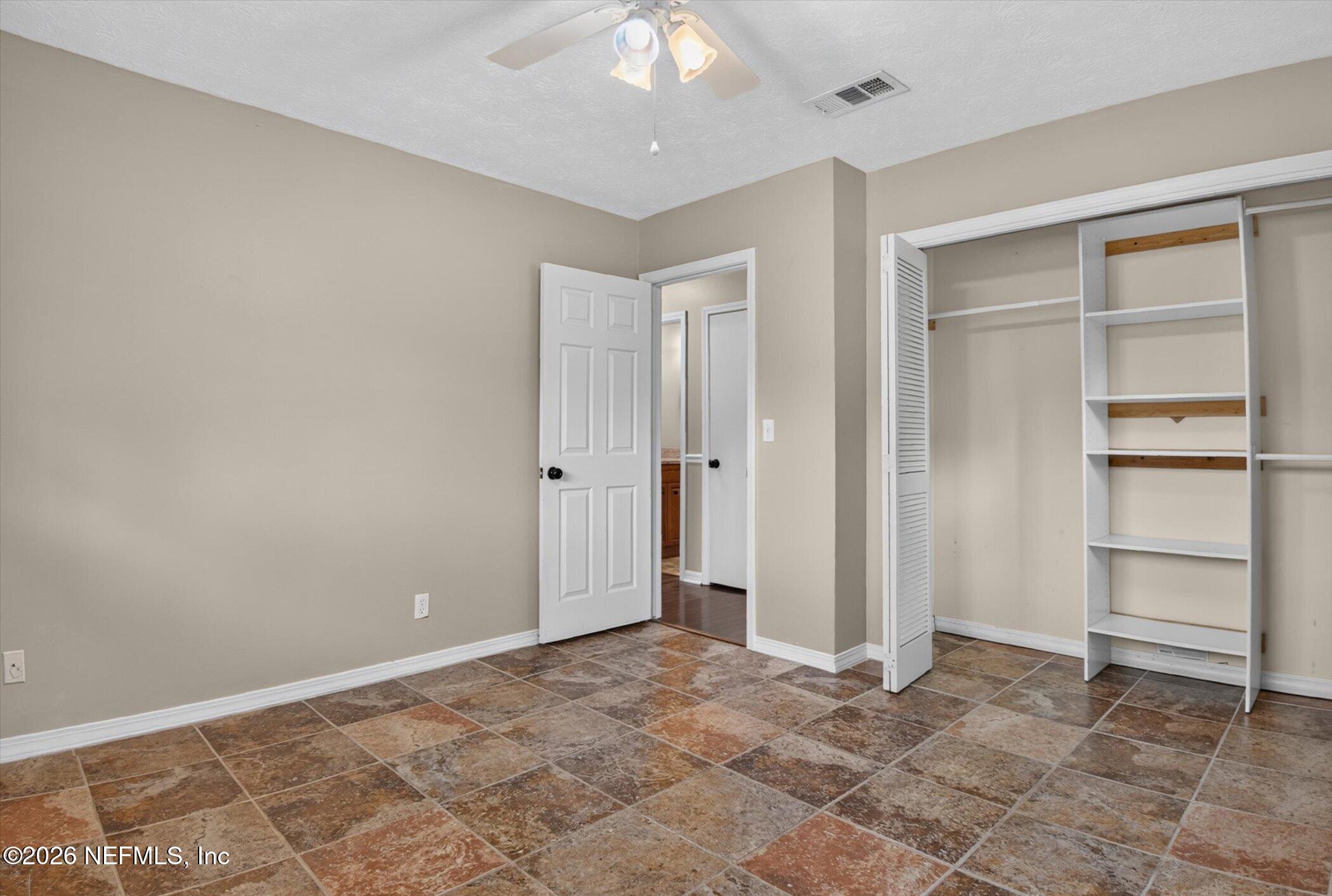 2705 Navajo Road Orange Park, FL 32073 - Photo 30 of 58 a view of an empty room with a closet