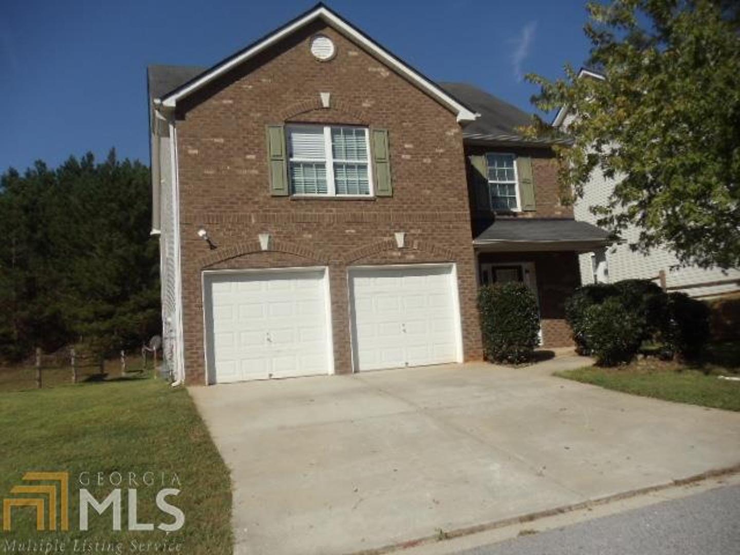 4054 Riverside Parkway Decatur, GA 30034 - Photo 1 of 1 a front view of a house with a yard