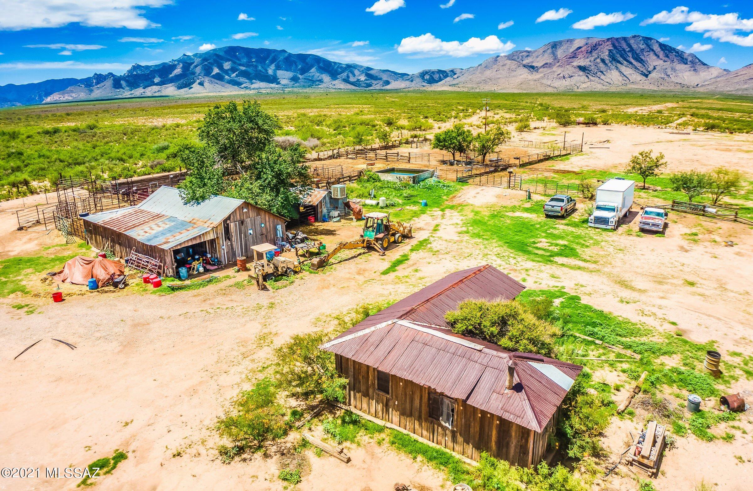 Original Homestead House (right) & Combined Workshop/Storage Building (left)