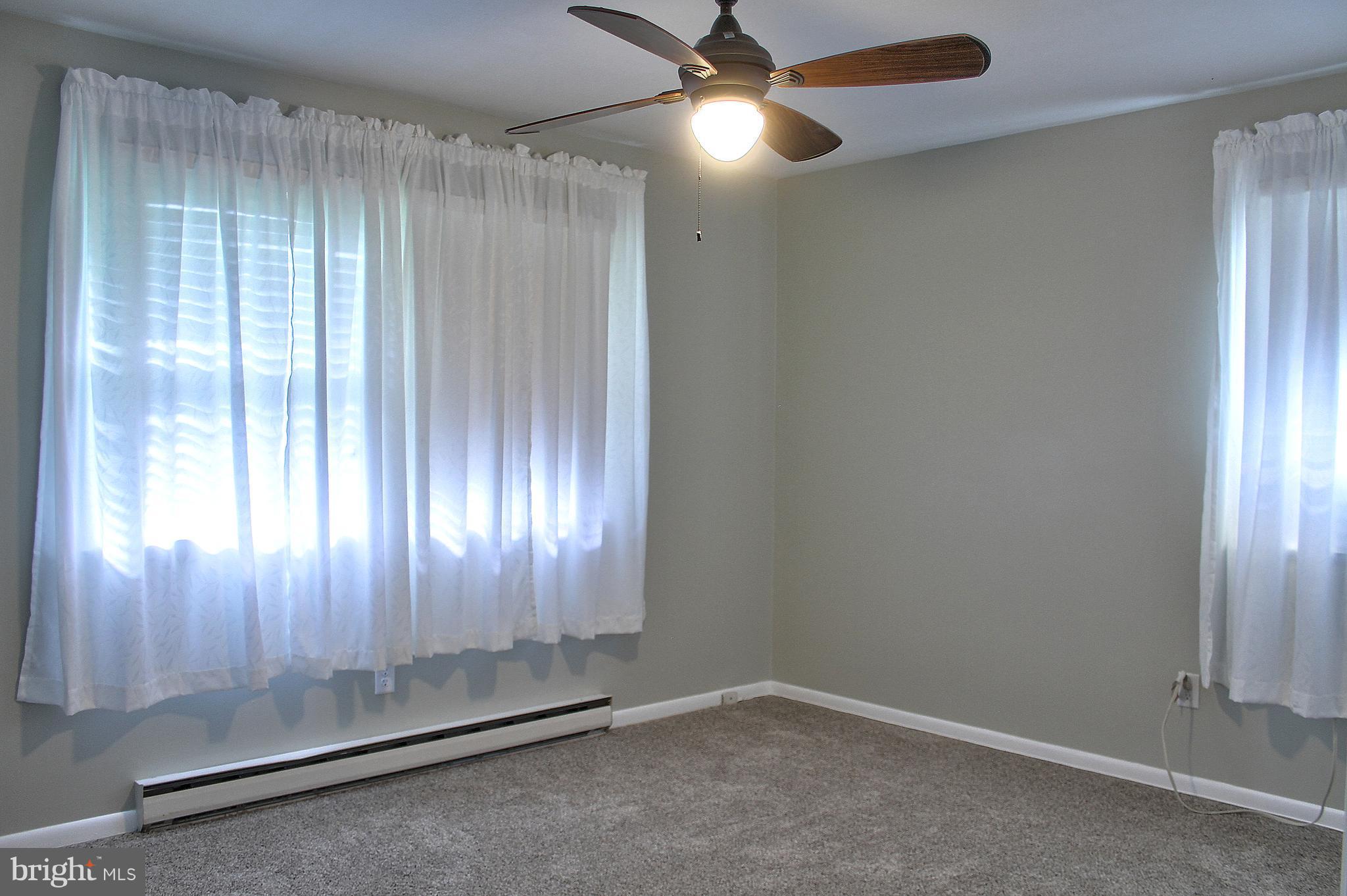 2409 Gillis Road Mount Airy, MD 21771 - Photo 12 of 27 an empty room with windows and fan