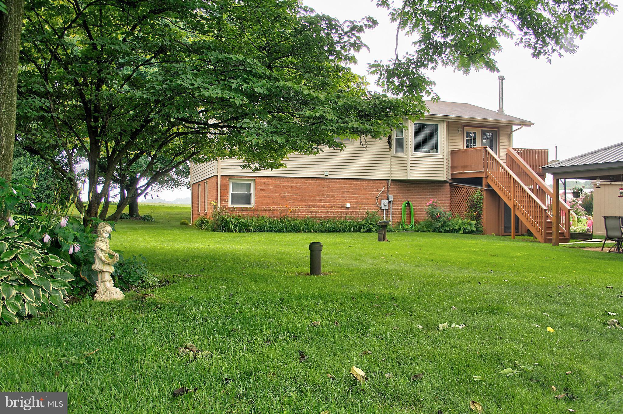 2409 Gillis Road Mount Airy, MD 21771 - Photo 19 of 27 a house view with garden space and trees