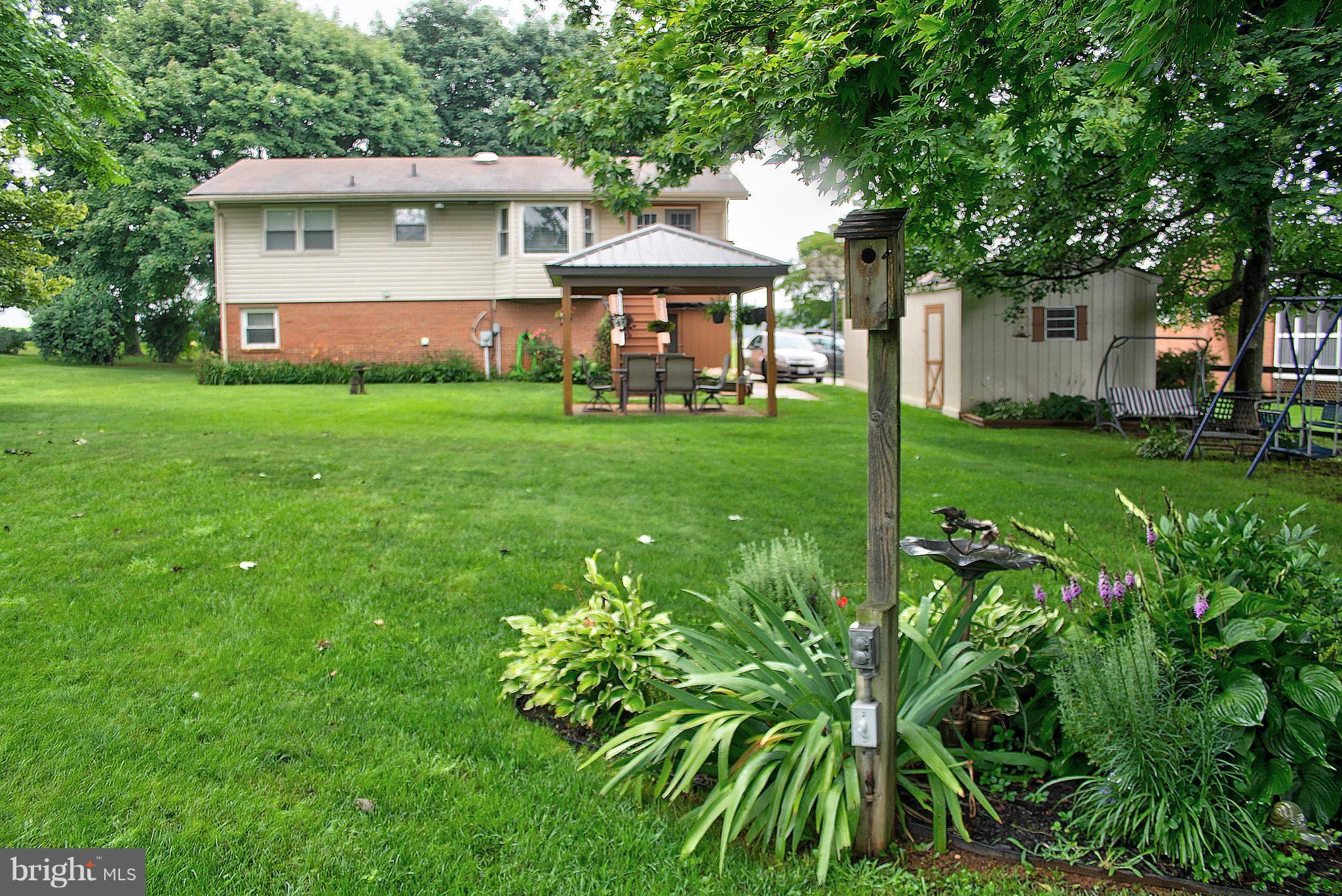 2409 Gillis Road Mount Airy, MD 21771 - Photo 20 of 27 a front view of a house with garden