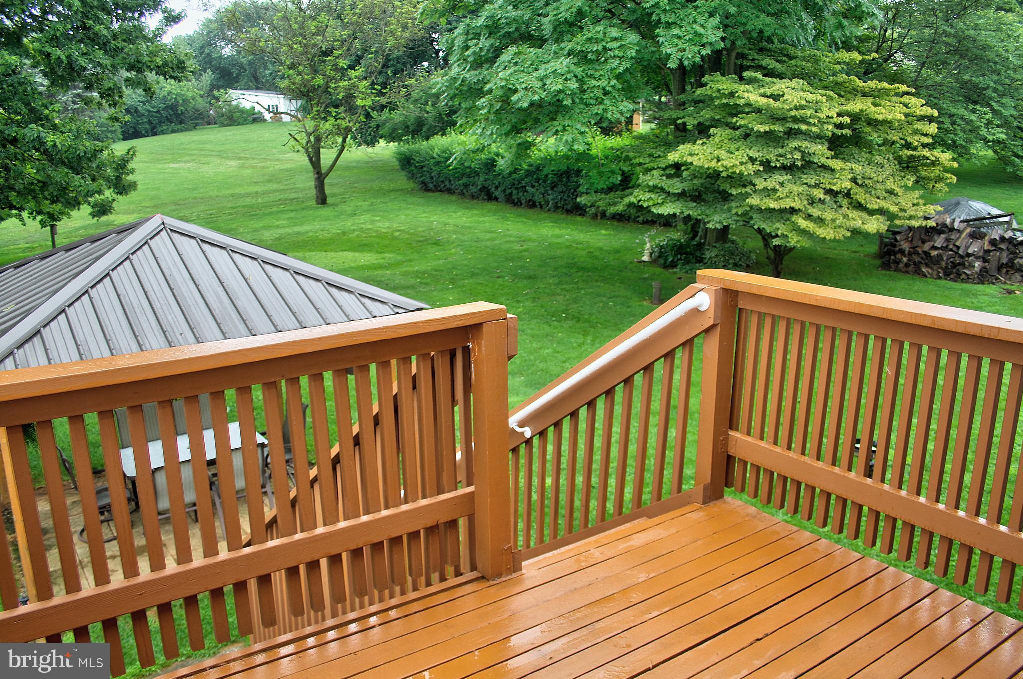 2409 Gillis Road Mount Airy, MD 21771 - Photo 23 of 27 a view of backyard with deck and garden