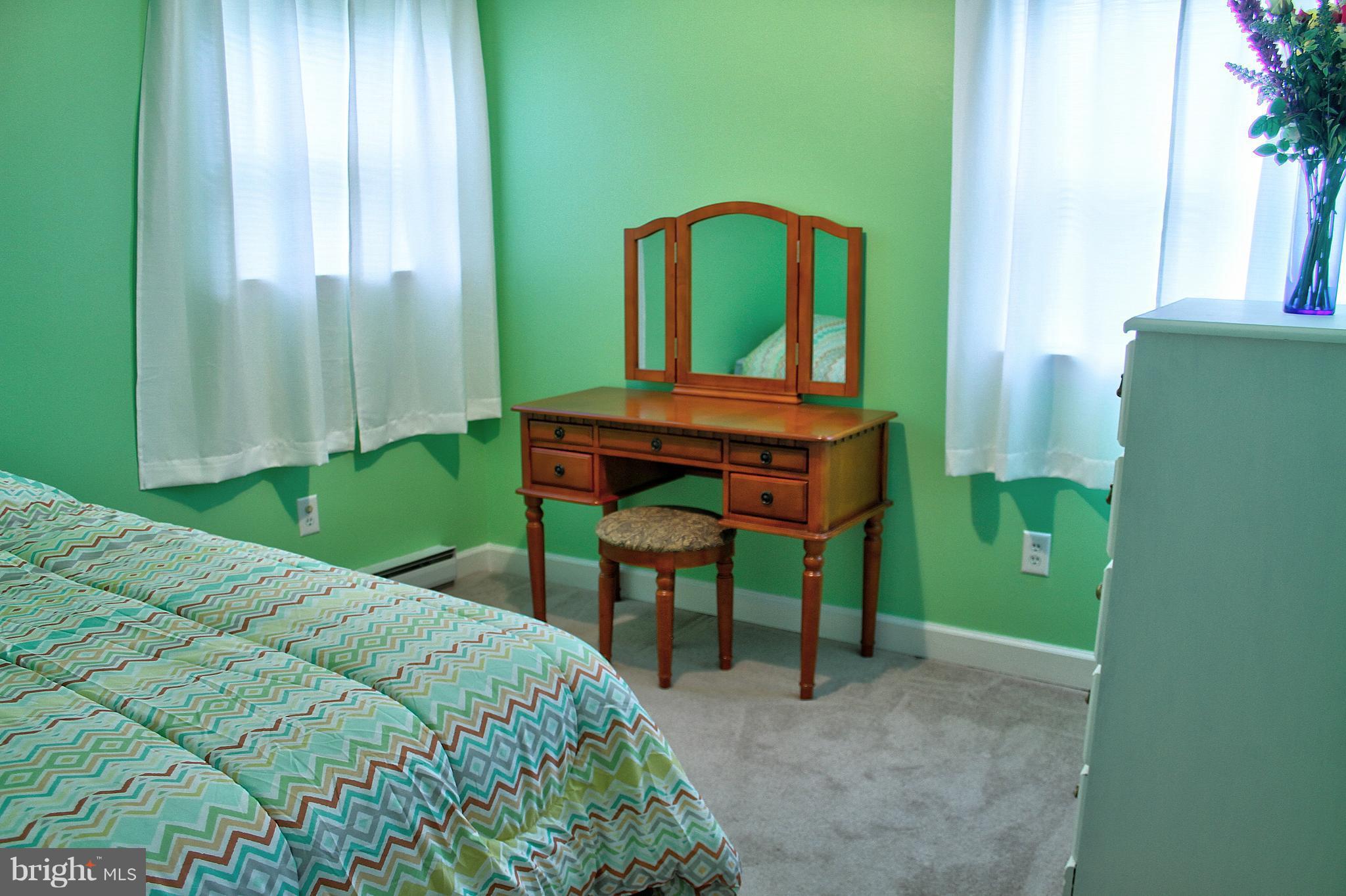 2409 Gillis Road Mount Airy, MD 21771 - Photo 4 of 27 a bedroom with a bed and a mirror